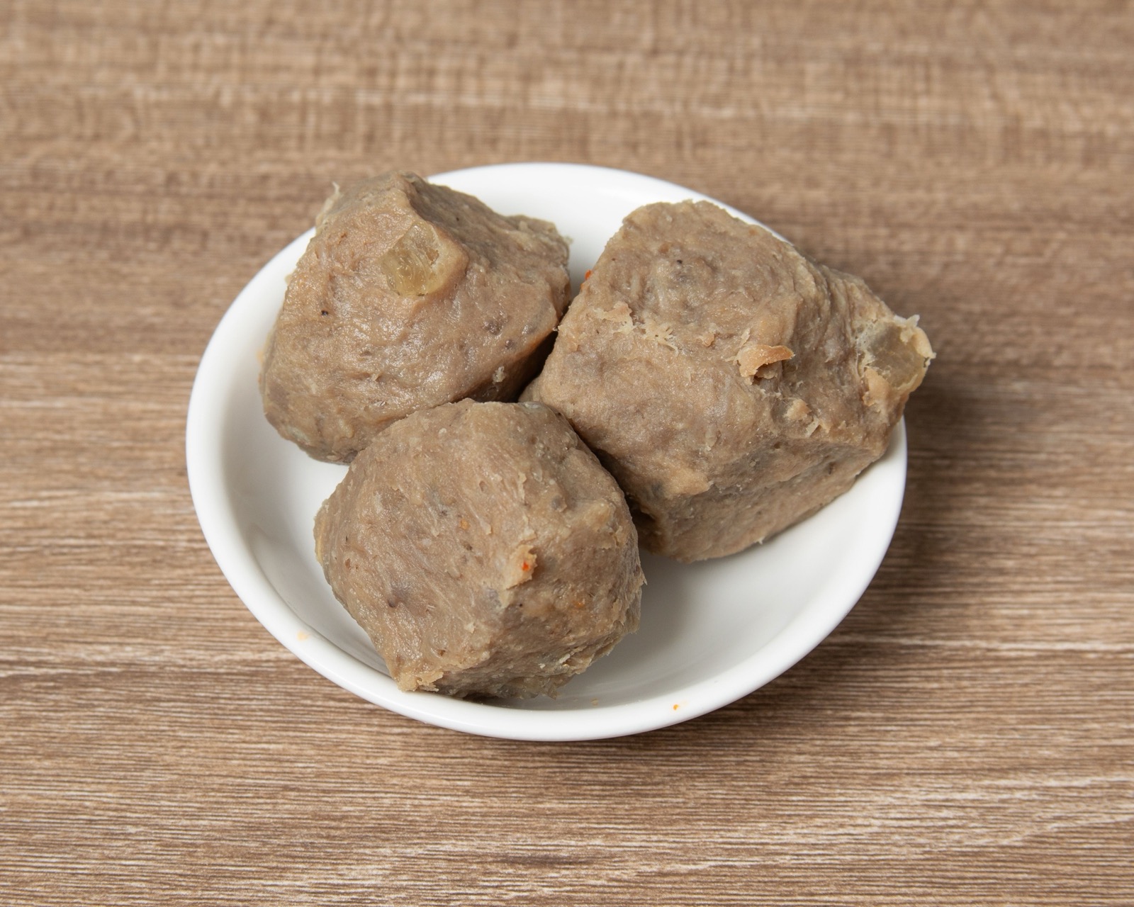 Hand-crafted beef balls served in a savory malatang broth